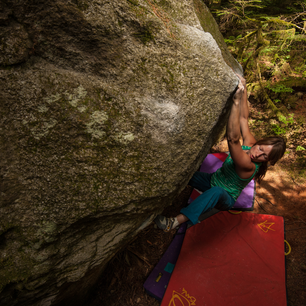 Jess climbing one of the innumerable granite blocks in the forest below the Chief.